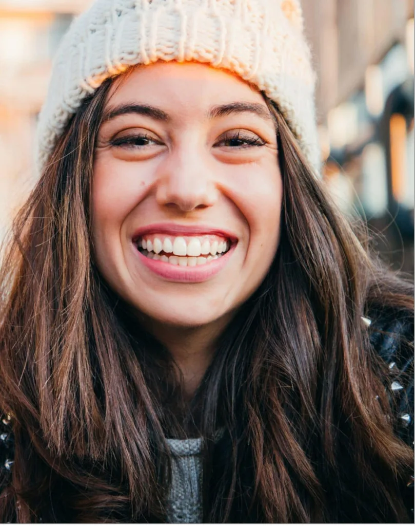 Woman smiling after scheduling her orthodontic appointment